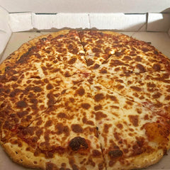 Unique halal over the moon pizza - half-moon calzone filled with doner meat, tomato sauce and cheese. Order the best halal calzone near you