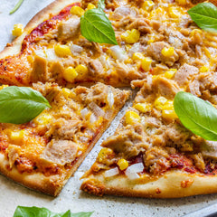 Fresh halal tuna pizza with tuna, sweet corn and onions on tomato sauce with cheese. Order the best halal tuna pizza near you from MiBurger for takeaway or delivery.